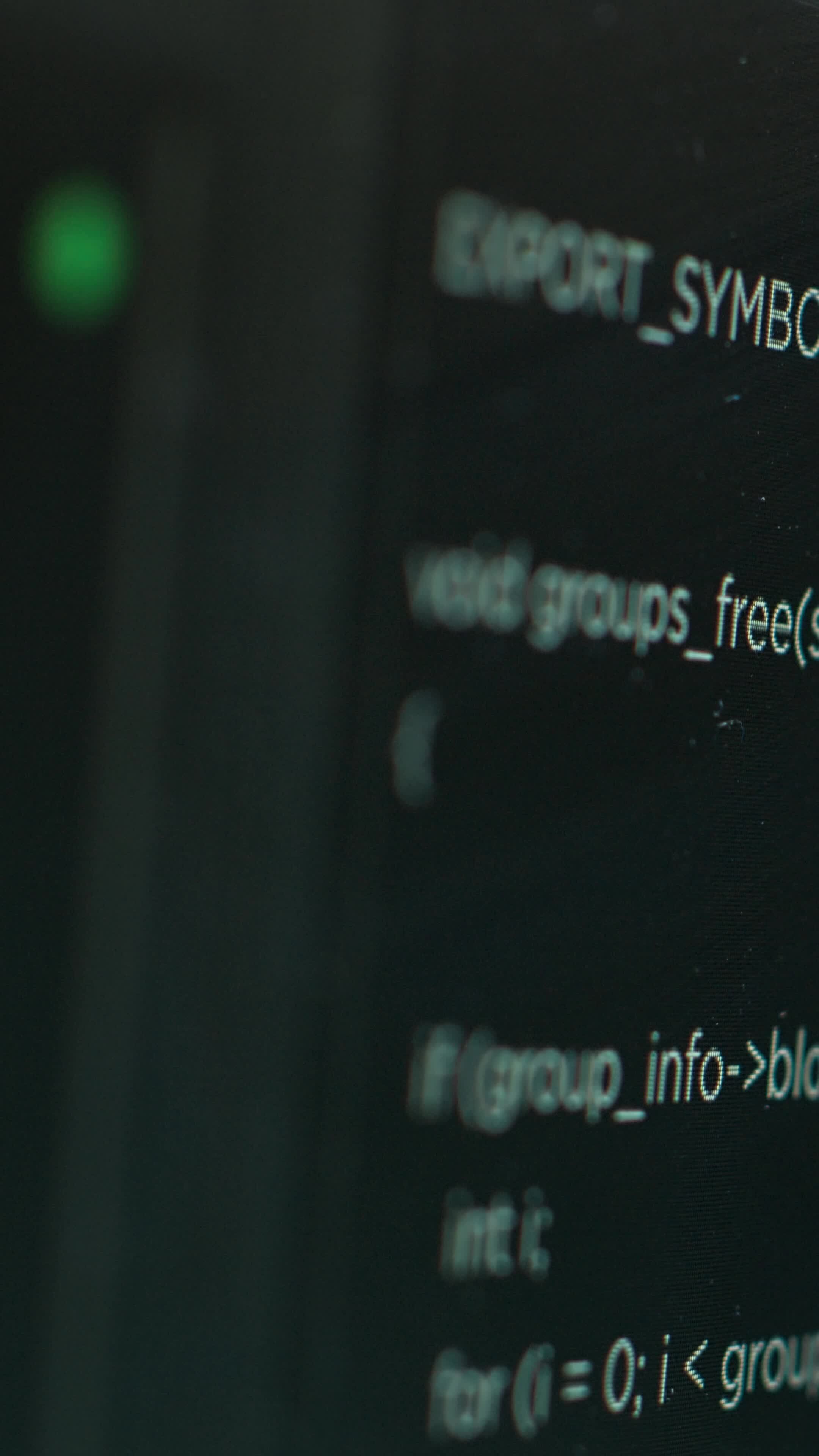 Vertical Extreme close up shot of hacking code running on computer ...