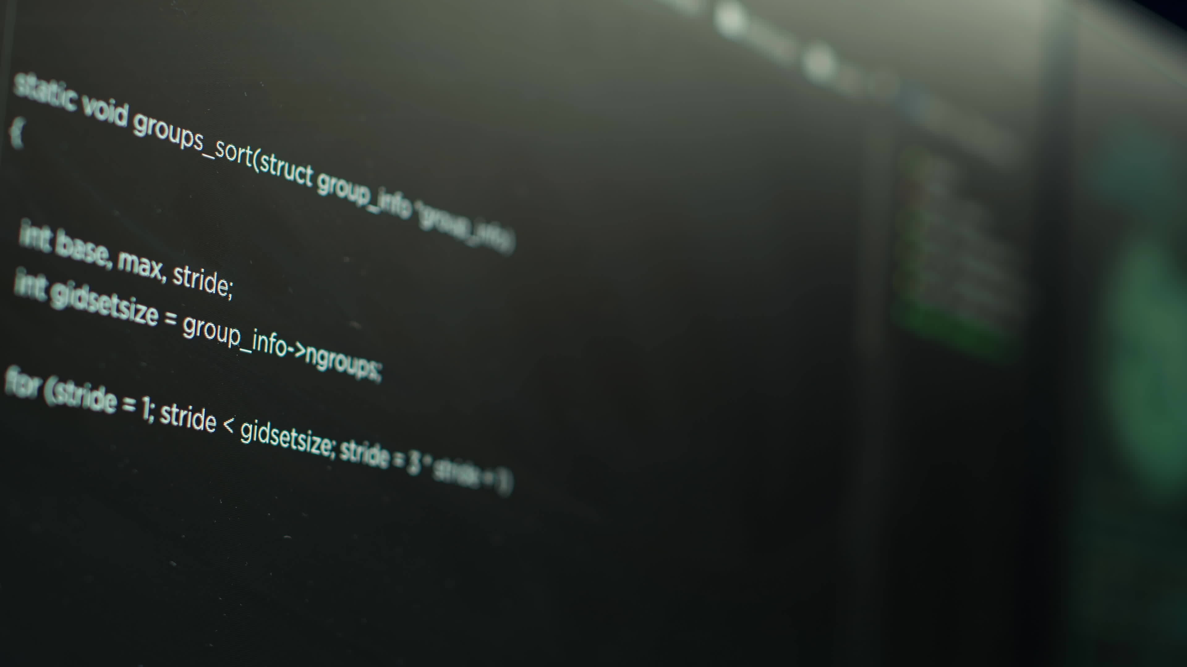 Extreme close up shot of lines of code displayed on computer monitors ...