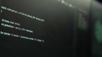 Extreme close up shot of lines of code displayed on computer monitors used by cybercriminal stealing sensitive information. Virus scripts running on PC infecting network systems, breaking passwords video