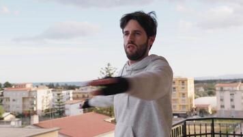 Young Man Warms Up Before The Gym Outside video