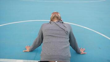 Athletic Person Does Relaxation Stretch In Basketball Court video