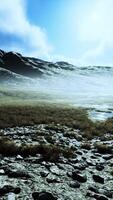 Stones covered with grass and moss under bright sky of Nepal video