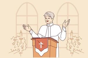 Man priest with smile leads sermon in catholic church, standing behind podium with crucifix vector