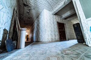 Crumbling walls of architecture. Old abandoned corridor of house. photo