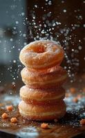 Donuts with sugar and nuts on dark background photo