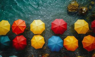 Colorful umbrellas floating in the sea photo