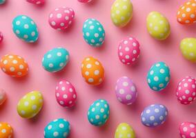 Colorful Easter egg pattern on pink background photo