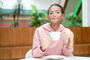 Black african american woman with vitiligo pigmentation skin problem indoor dressed pink hoodie photo