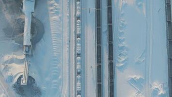 A snowy highway with a truck driving, view from above video