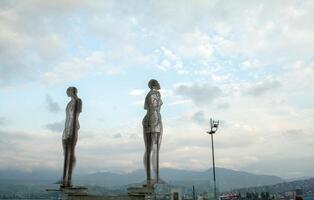 Batumi, Georgia August, 2018 A moving metal sculpture titled Man and Woman or Ali and Nino photo