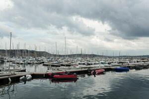 Morgat, France 29 May 2018 Panoramic outdoor view of sete marina Many small boats and yachts aligned in the port. Calm water and blue cloudy sky. photo