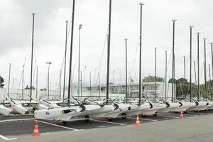 Morgat, France 29 May 2018 Catamarans storage without sails parked on the beach photo