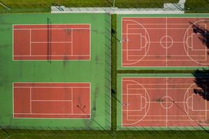 View from the height of the empty Tennis courts in the daytime in summer photo