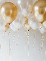 Gold and white balloons with ribbons against on white background. Celebration decoration concept for weddings, anniversaries, and birthday parties with copy space for text. Ai generation. photo