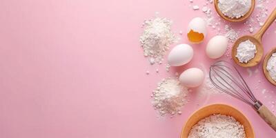 Baking ingredients on pink background with copy space. Eggs, flour in wooden spoons, and whisk. Top view of pastry or cake preparation concept. For recipe layouts, culinary designs. Ai photo