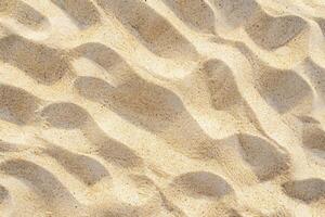 Textured sandy beach surface with ripples and granules of sand, close up. Nature pattern and texture concept. Background for design and display. Ai generation photo