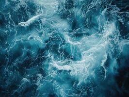 Top view of ocean waves churning with foam, creating intricate patterns of white and deep blue, dynamic water texture. Marine background. Ai generation photo