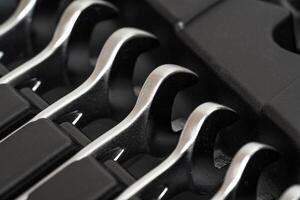 Wrenches lying in a row in a toolbox. photo