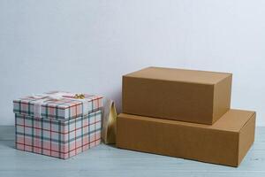 Gift boxes on a light table on a white background. photo