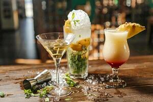 Wooden Table With Three Different Types of Drinks photo