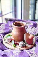 Clay Pot With Spoon on Plate, Rustic Kitchen Decor photo