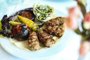 White Plate With Freshly Grilled Meat and Colorful Vegetables photo