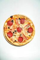 Small Pepperoni and Olive Pizza on White Surface photo