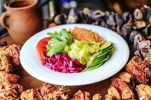 Delicious Plate of Food With Lettuce, Tomato, and Meat photo