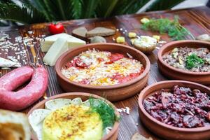 Wooden Table With Bowls of Food photo