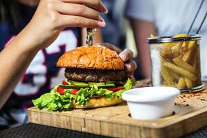 Close-Up of Hamburger on Cutting Board photo