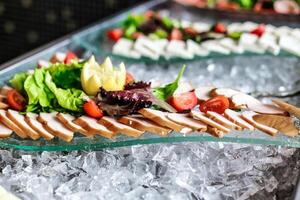 Platter of Freshly Grilled Meat and Seasonal Vegetables on Ice photo