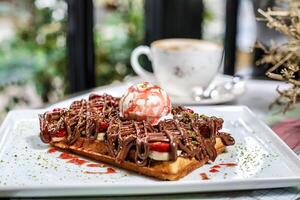 White Plate With Waffles Covered in Delicious Toppings photo