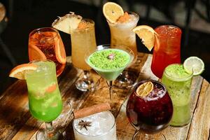 Assorted Drinks Arranged on a Wooden Table photo
