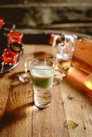 Wooden Table With Two Glasses of Liquid photo