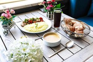 Table Set With Assorted Food and Drinks photo