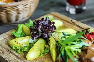 Wooden Cutting Board With Fresh Salad Toppings photo