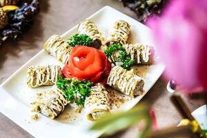 Rolled Up Food on a White Plate photo