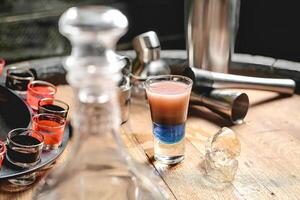 Wooden Table With Glasses and Bottle photo