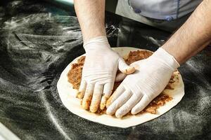 Person Wearing White Gloves Holding Gloves on a Plate photo