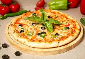 Pizza on Wooden Cutting Board photo