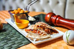 Plate of Food Next to Judges Gavel on Table photo