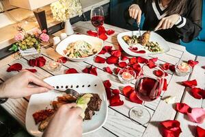 Couple Enjoying a Meal Together at a Table photo