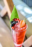 Refreshing Tall Glass Filled With Fresh Fruit and Ice photo