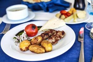 White Plate With Meat and Veggies, Delicious Meal photo