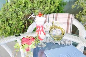 Decorative Vase Filled With Vibrant Flowers on a Wooden Table photo