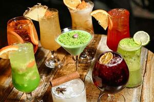 Assorted Drinks Arranged on a Wooden Table photo