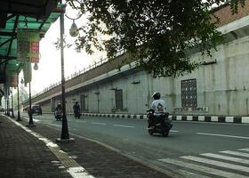 Surakarta, Central Java, Indonesia April 11, 2024. A sight seeing of Main Roads Slamet Riyadi Street in the morning. Not busy yet. People still preparing for their activity photo