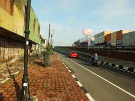 Surakarta, Central Java, Indonesia April 11, 2024. A sight seeing of Main Roads Slamet Riyadi Street in the morning. Not busy yet. People still preparing for their activity photo