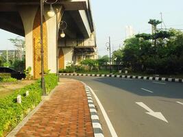 Surakarta, Central Java, Indonesia April 11, 2024. A sight seeing of Main Roads Slamet Riyadi Street in the morning. Not busy yet. People still preparing for their activity photo