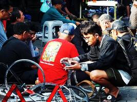 Surakarta City, Central Java, Indonesia, April 15, 2024. Notoharjo Market. The flea market is located on the outskirts of town, always busy with visitors in the morning. Buying and selling used goods photo